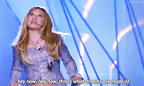 A gif of a woman singing