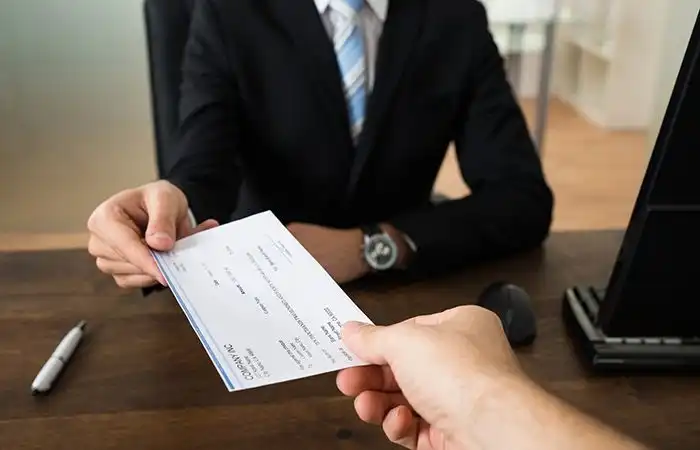 Handing paycheck