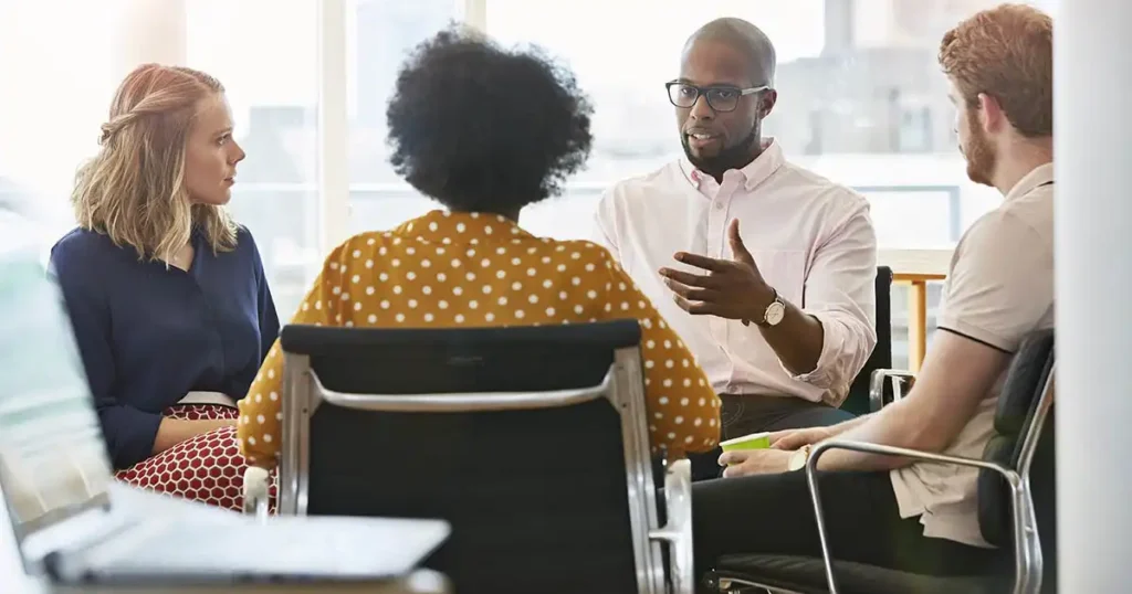 Colleagues surrounded for a meeting