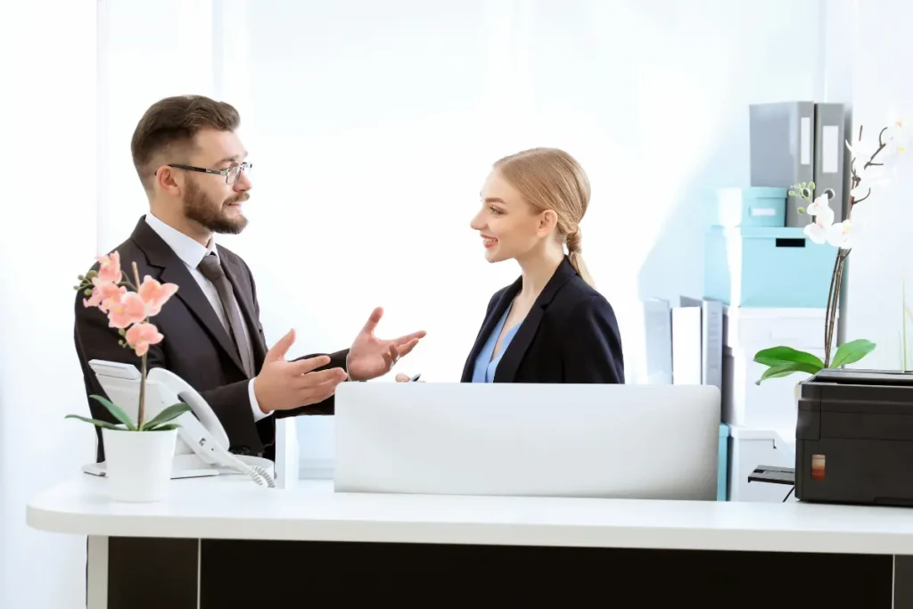 Two colleagues in a corporate suit having conversation. 