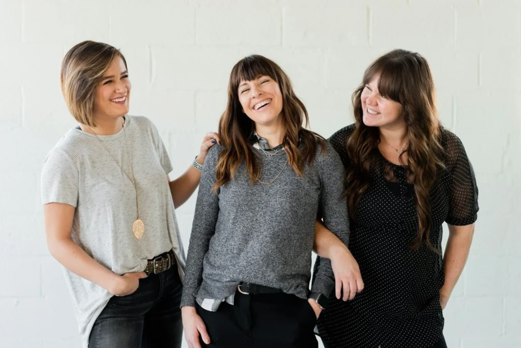 Three women smiling