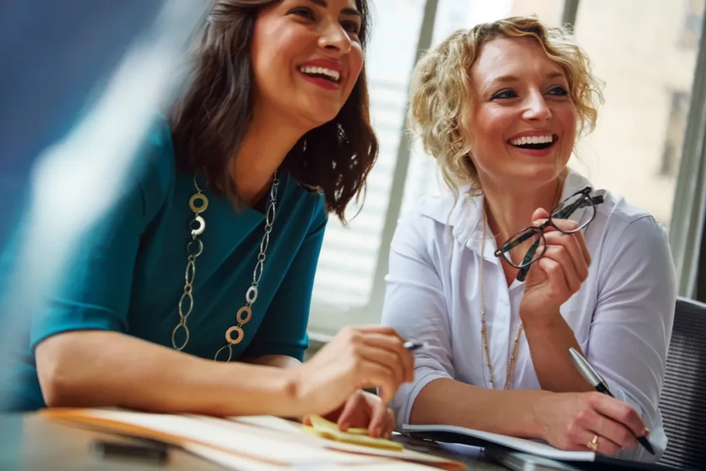 Two female colleagues smiling