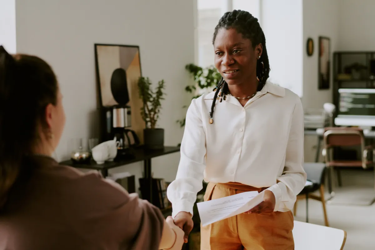 Woman shaking hands with an applicant