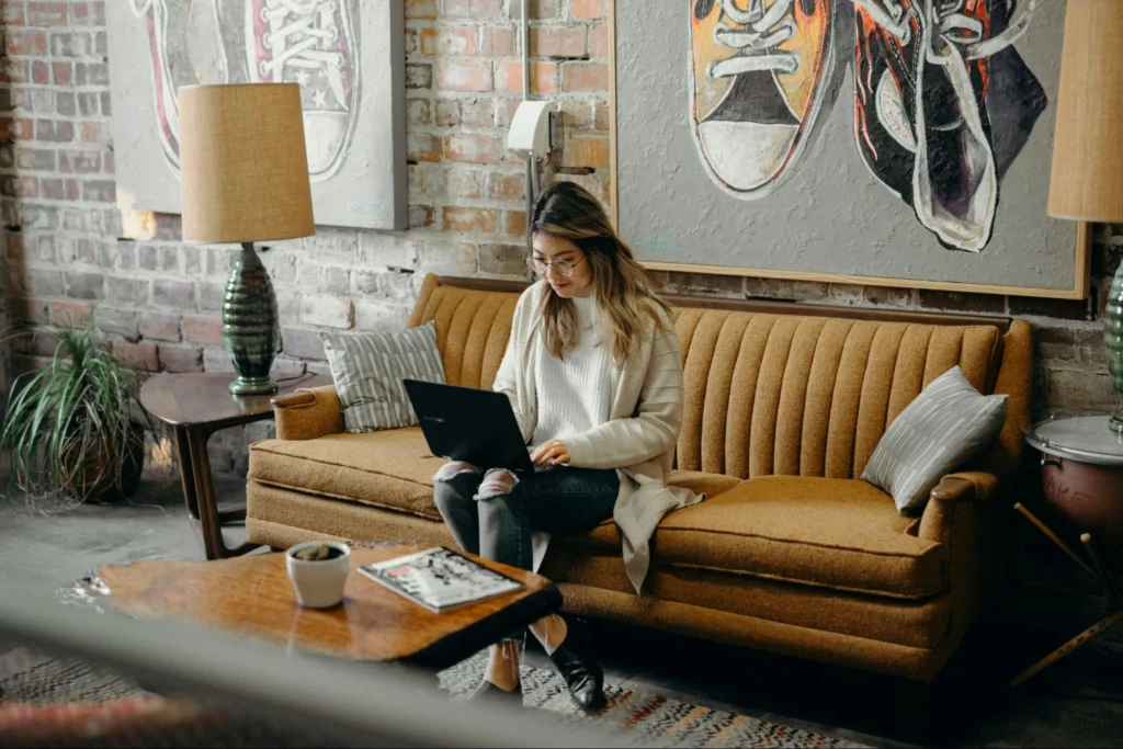 Woman sitting in the living room while working