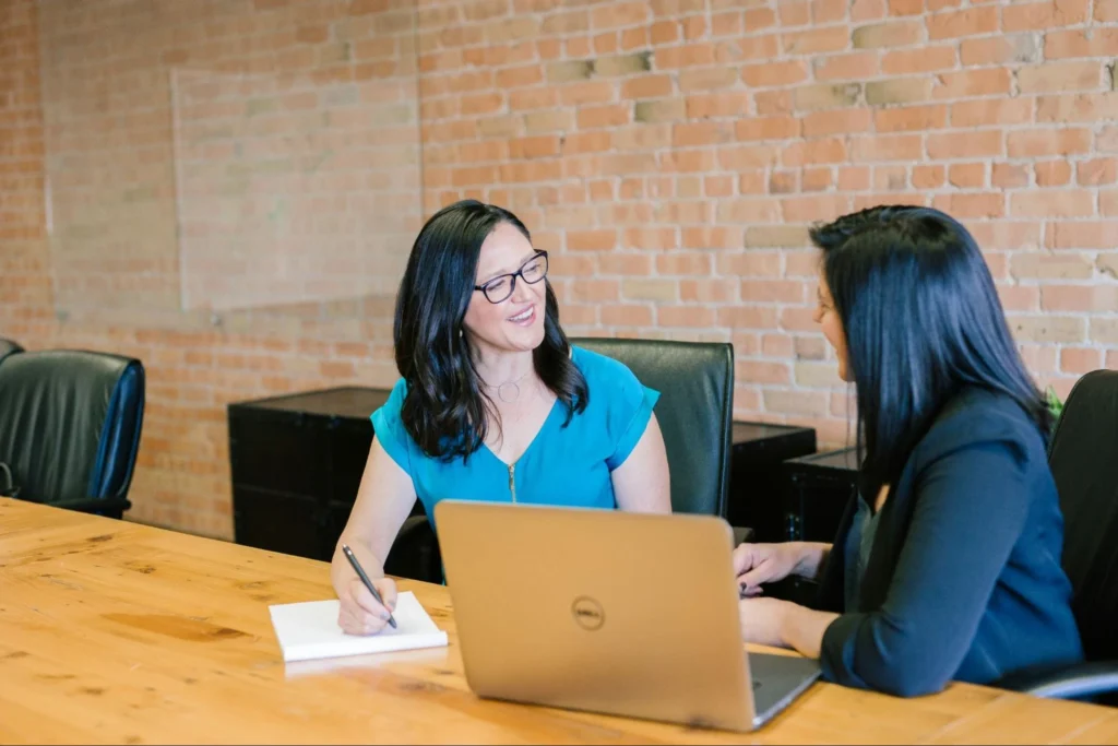 Two women talking in the meeting room