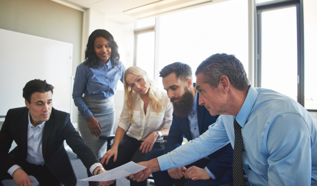 a group of colleagues working together at the office