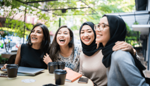 a group of women working together and smiling