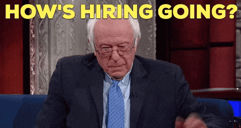 GIF of Bernie Sanders explaining with text that reads 'How's hiring going?' and a subtitle that says 'It's been a tough week