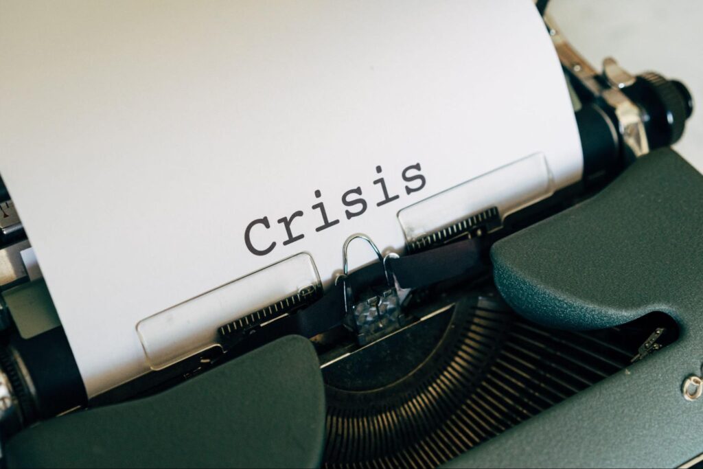 the word 'crisis' typed out on a typewriter