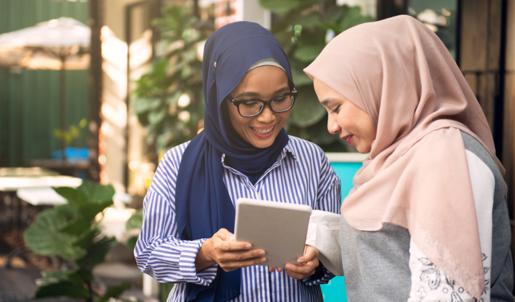 two employees happily chatting together