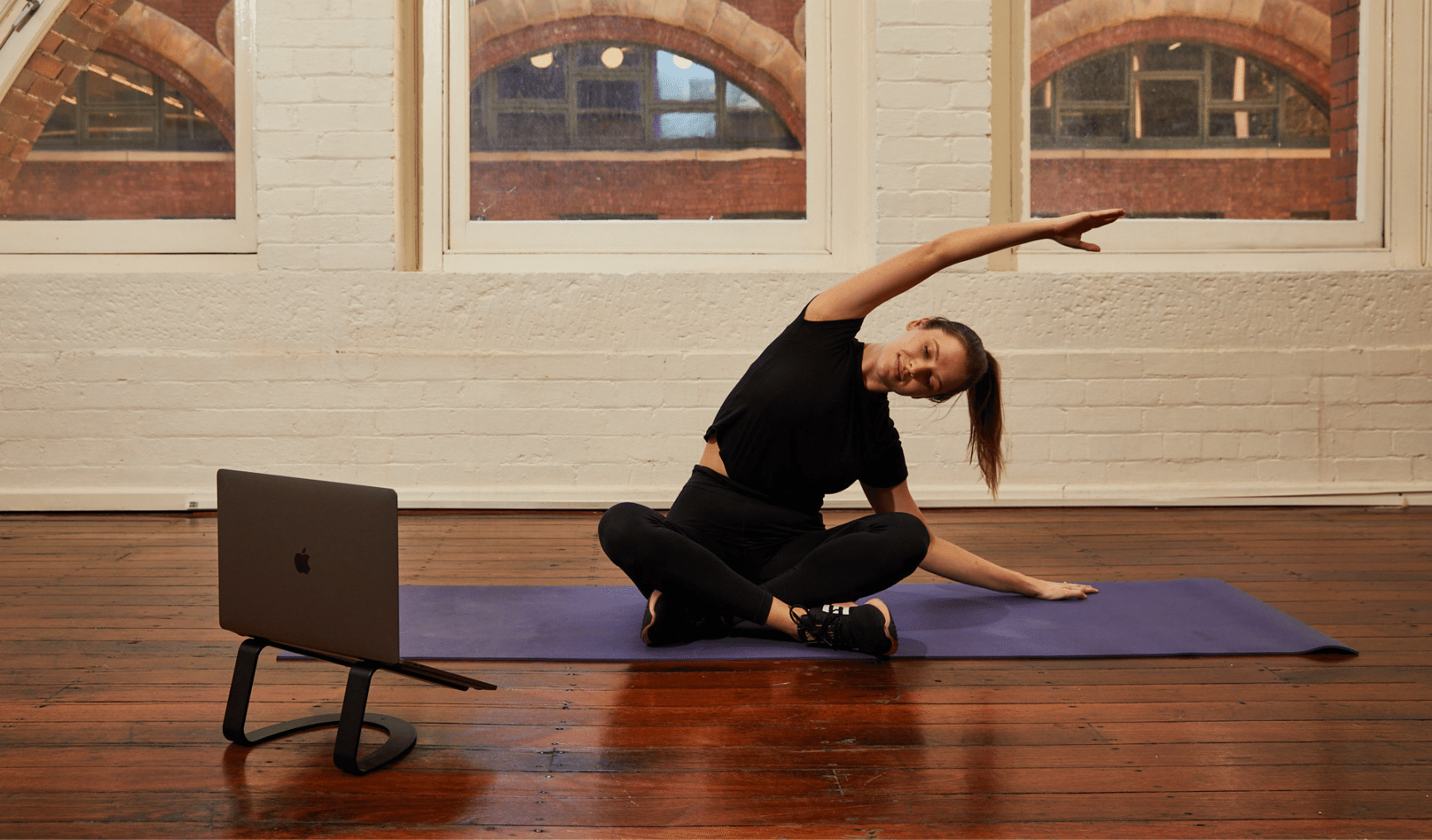 Woman doing virtual yoga