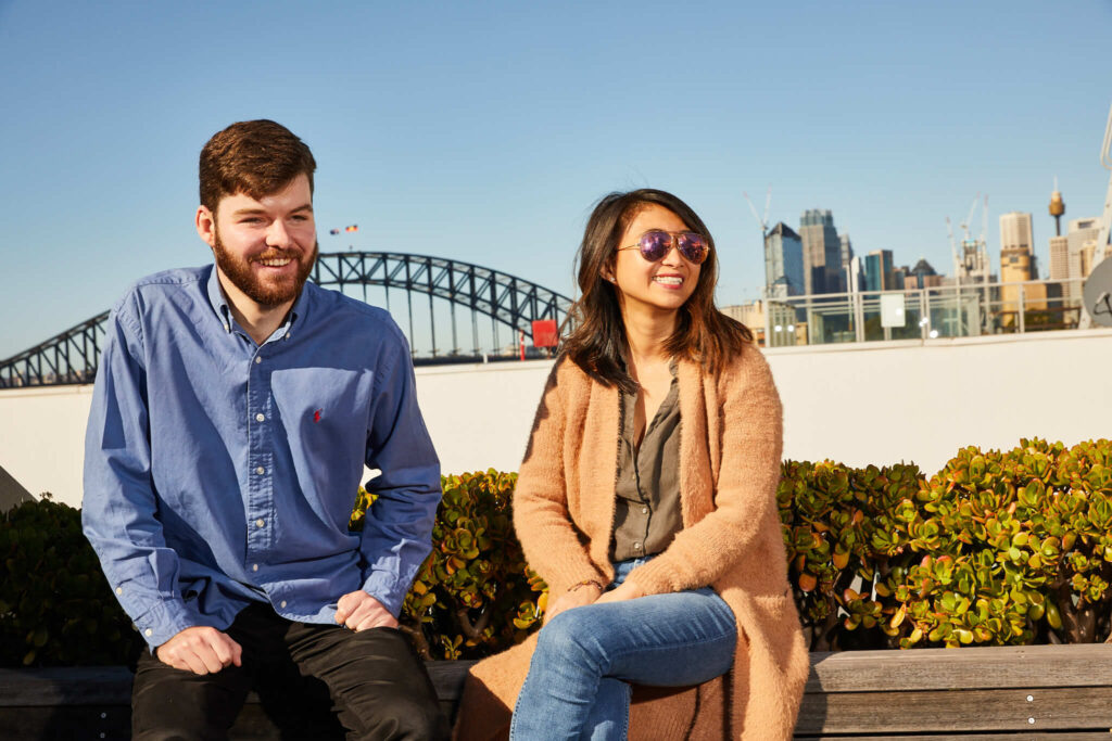 people sitting in front of harbour bridge