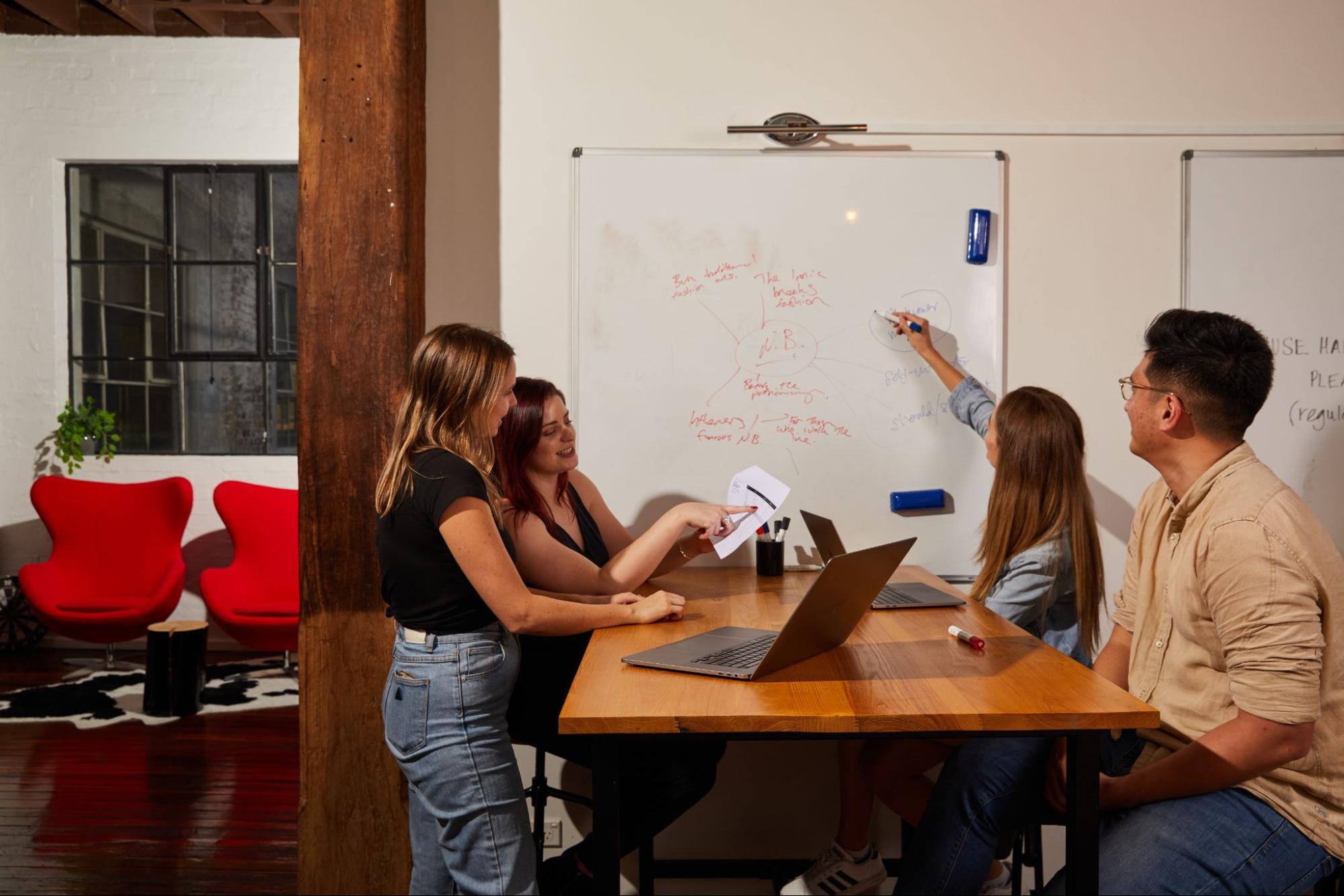 employees having a discussion in the office