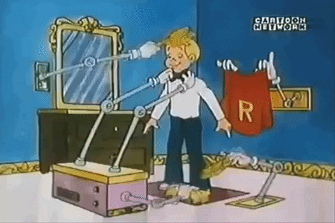 A boy stands in his room while multiple robotic arms help him get ready for the day