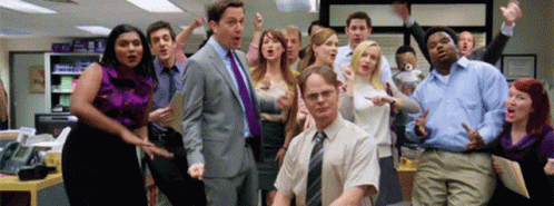 The cast of the Office all smile and cheer