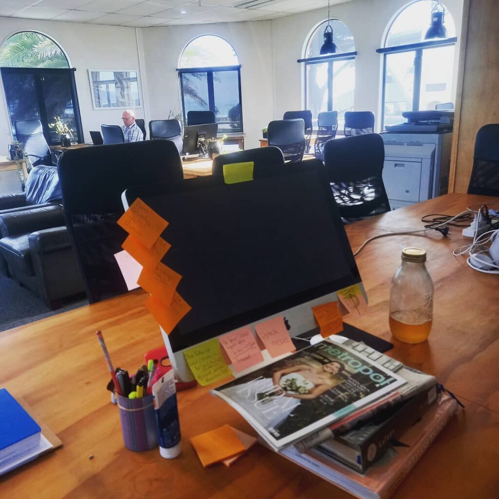 Computer covered in post it notes