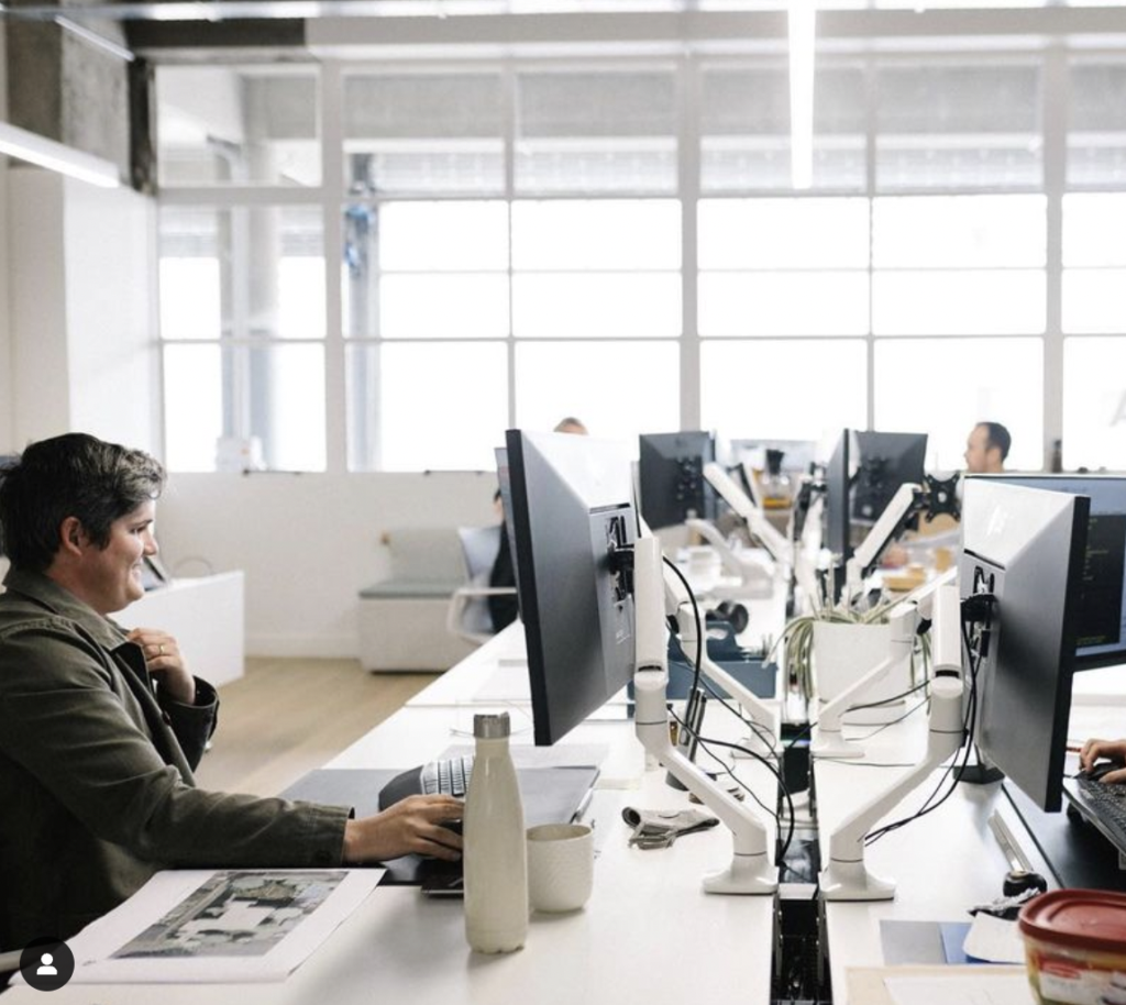 A person coworking at a computer at Panama in Hamilton
