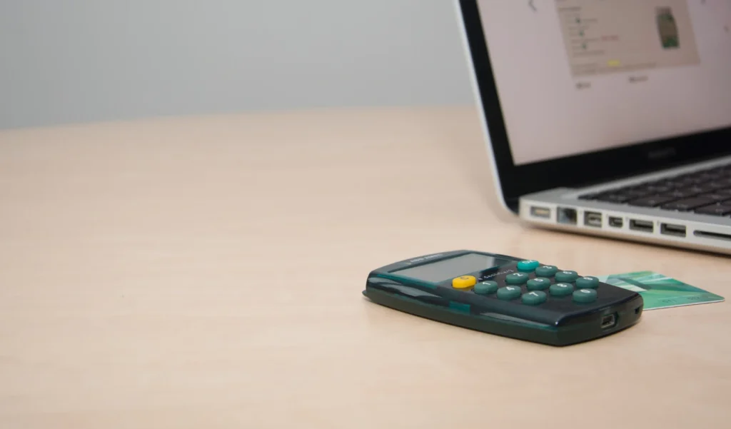 Calculator beside the laptop