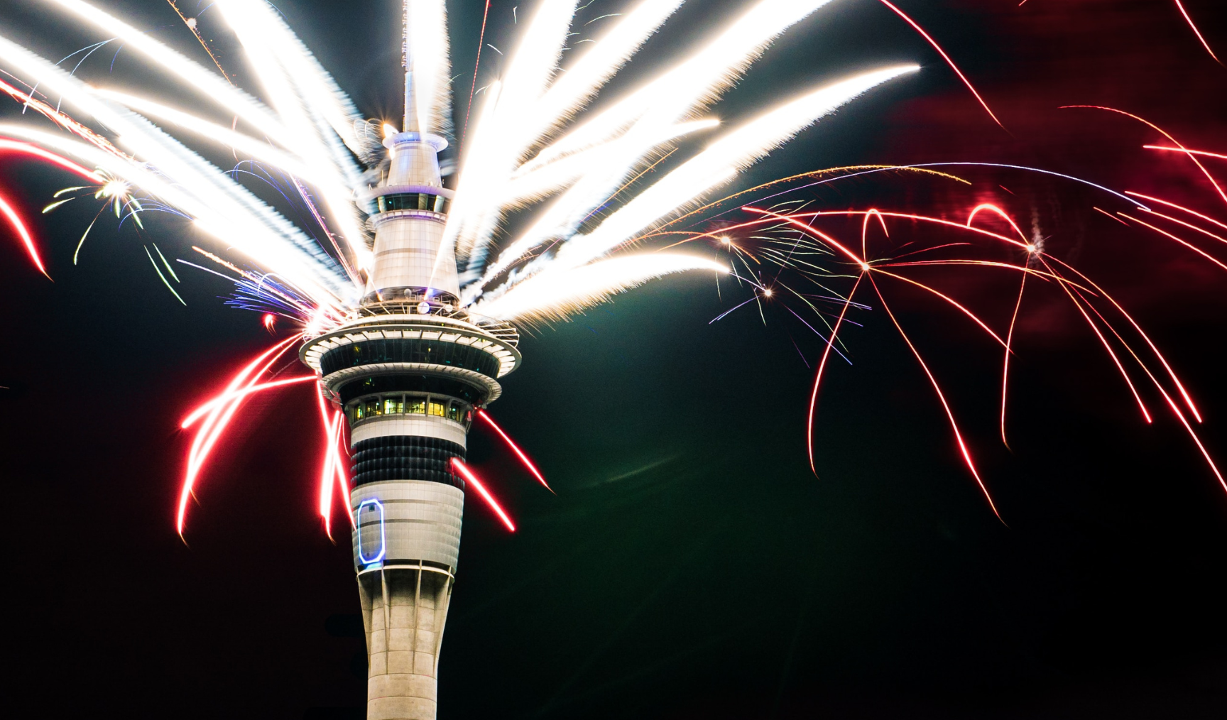 Sky City tower in Auckland, with fireworks behind it