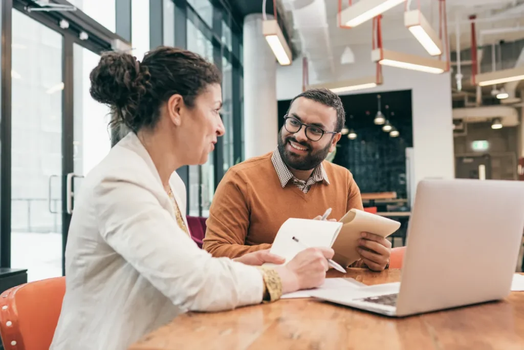 Colleagues brainstorming ideas in a well-lit environment