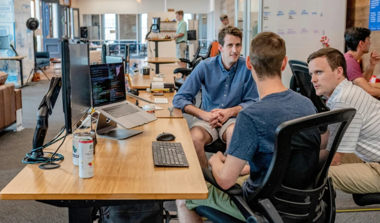 Three professionals in an office setting