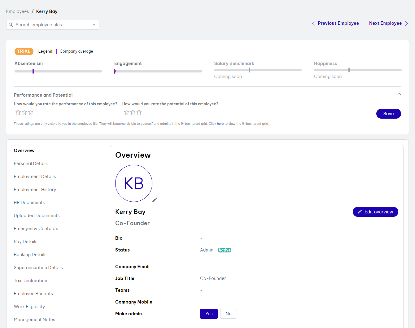 Employee profile interface displaying information for Kerry Bay, including performance and potential rating options, engagement, absenteeism, and sections for salary benchmark and happiness (coming soon). Overview section shows details like job title, admin status, and contact options. Sidebar includes tabs for Personal Details, Employment History, HR Documents, Emergency Contacts, Pay Details, and more.