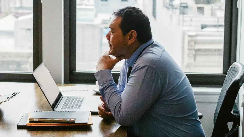 Man looking at his laptop