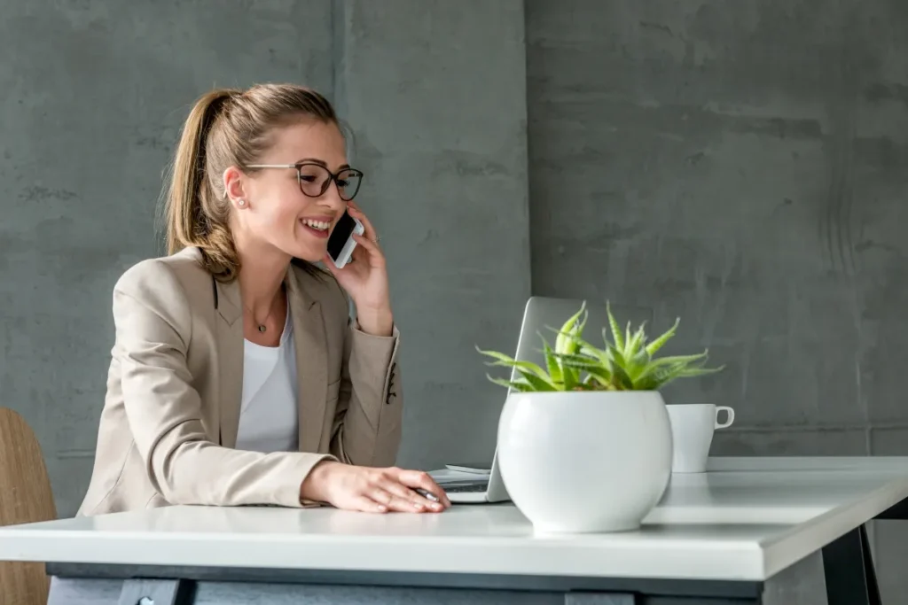 Woman calling on a phone while working