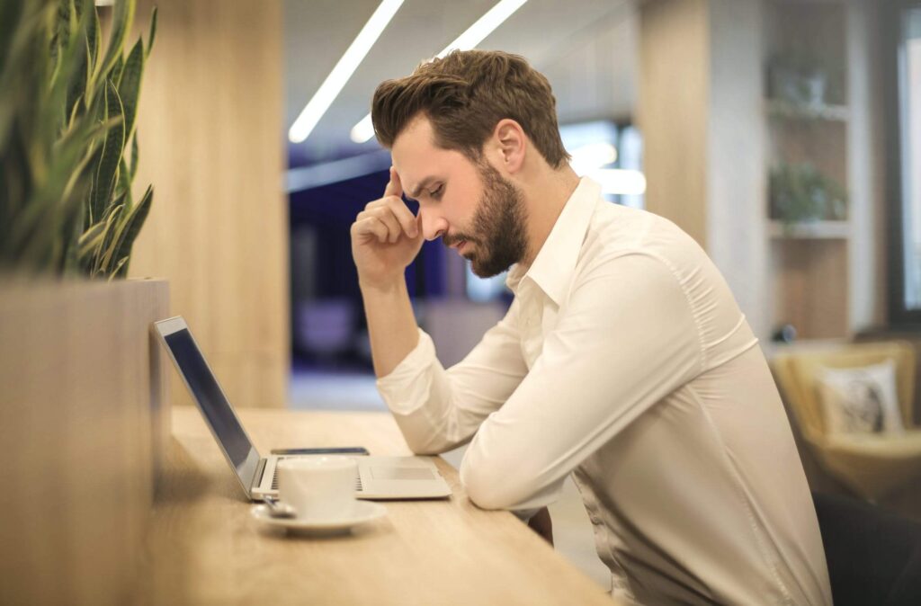 Image of a man stressed at work