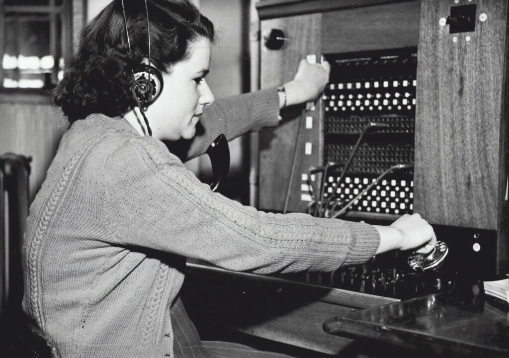 Black and white photo of woman working as a switchboard operator