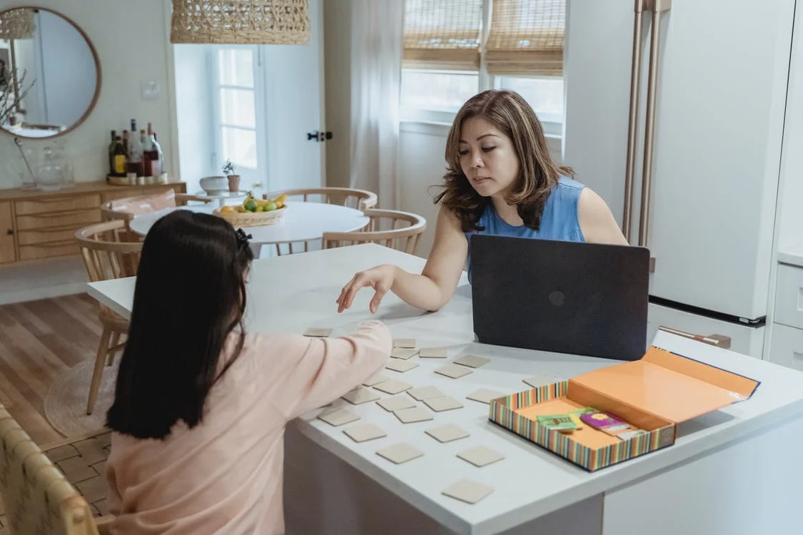 working parent at home with daughter