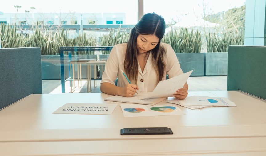 employee in office looking at materials