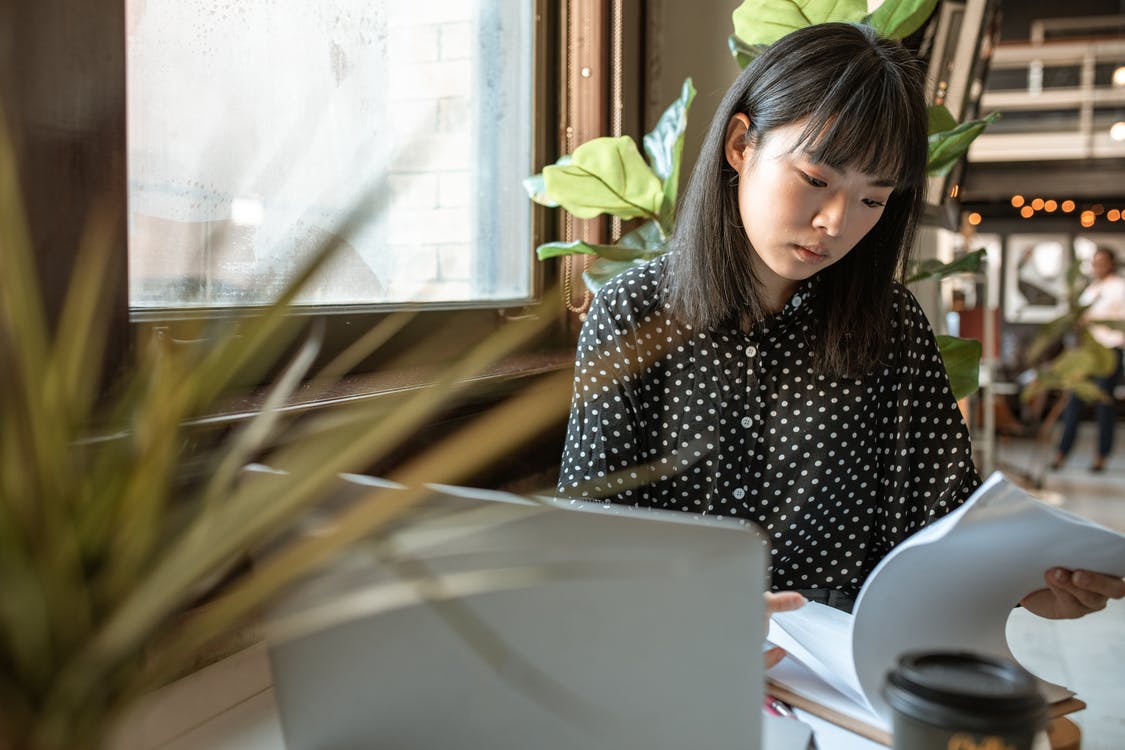 woman looking at documents in the office