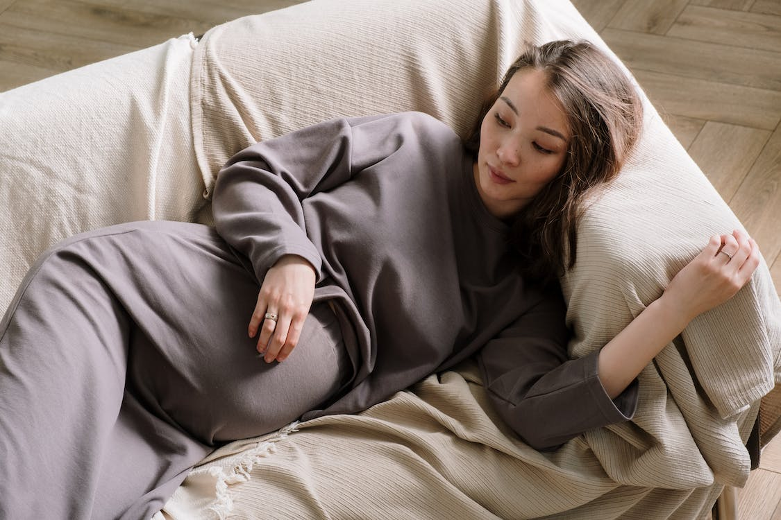 pregnant woman resting on the sofa