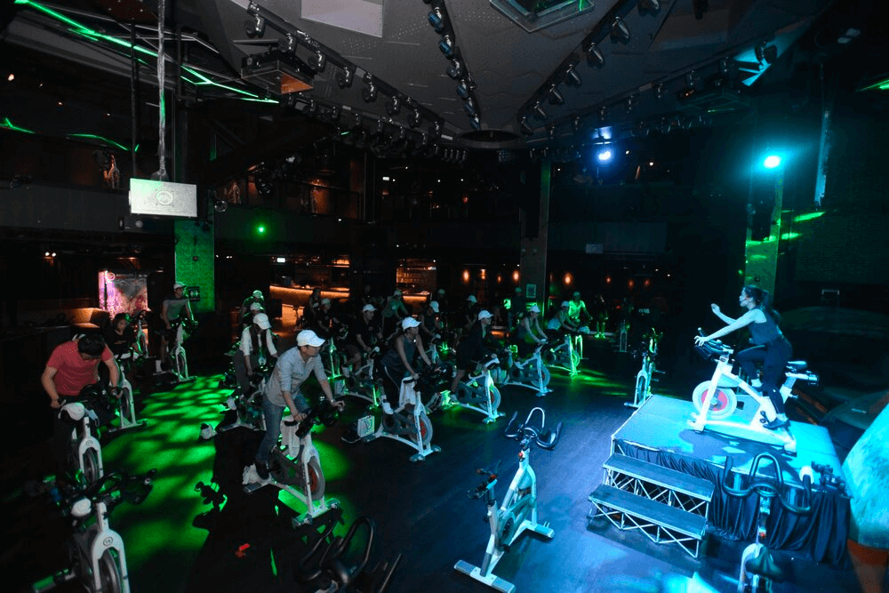 Team doing a spin class at Absolute Cycle