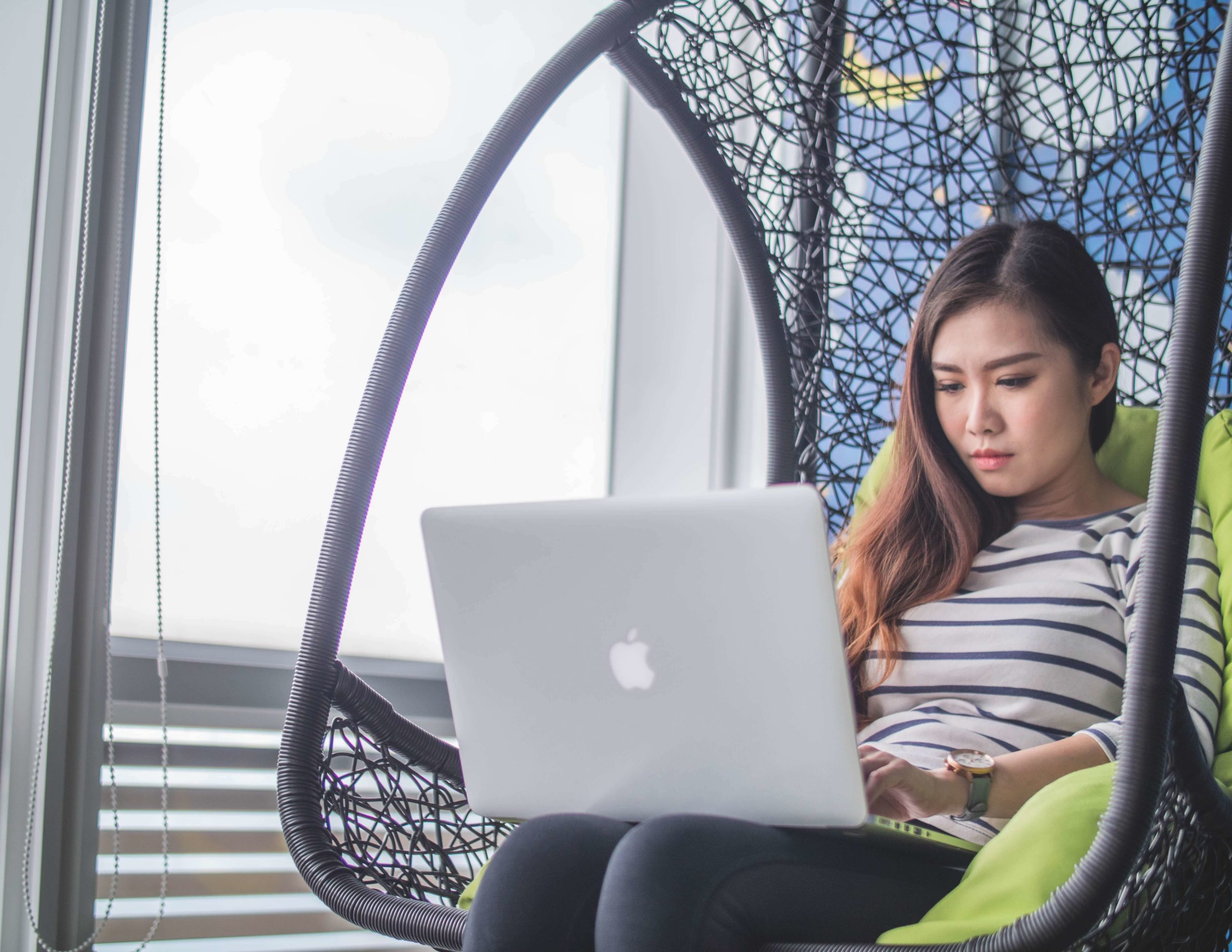 woman checking her laptop