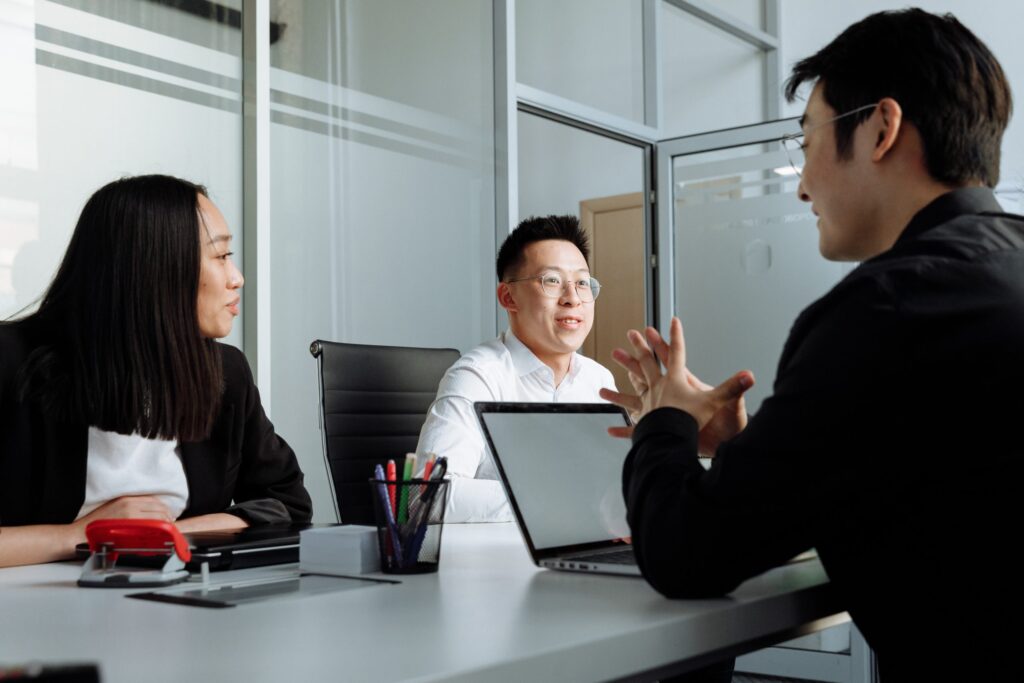 group of young colleagues having a discussion in a meeting room