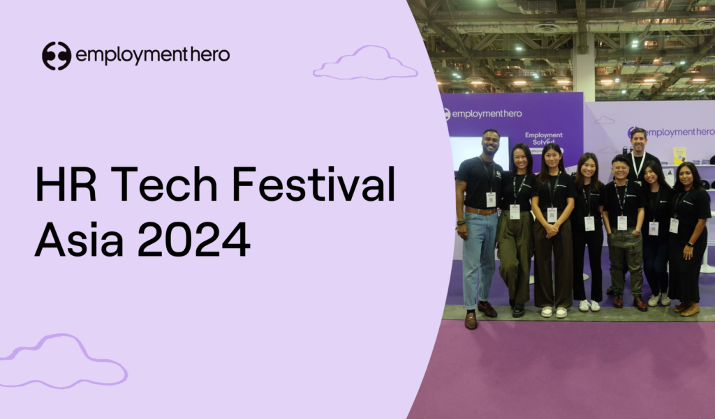 Employment Hero at the HR Tech Festival Asia 2024, featuring a group photo of team members standing together in front of the company booth at the event.