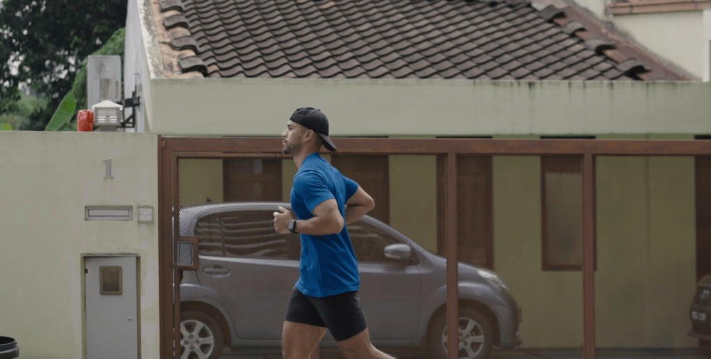 Harris jogging past a house