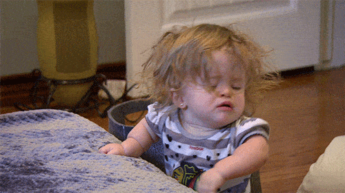 exhausted baby crying on the table