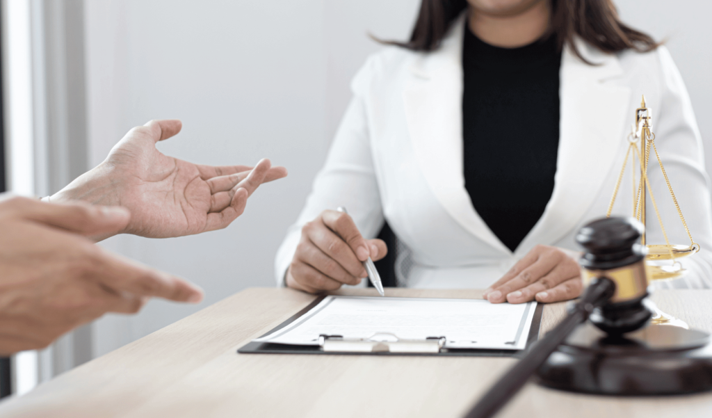 image of a woman sitting at a desk with documents