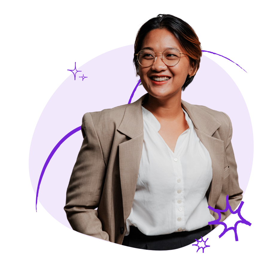 A woman wearing eyeglasses smiling.