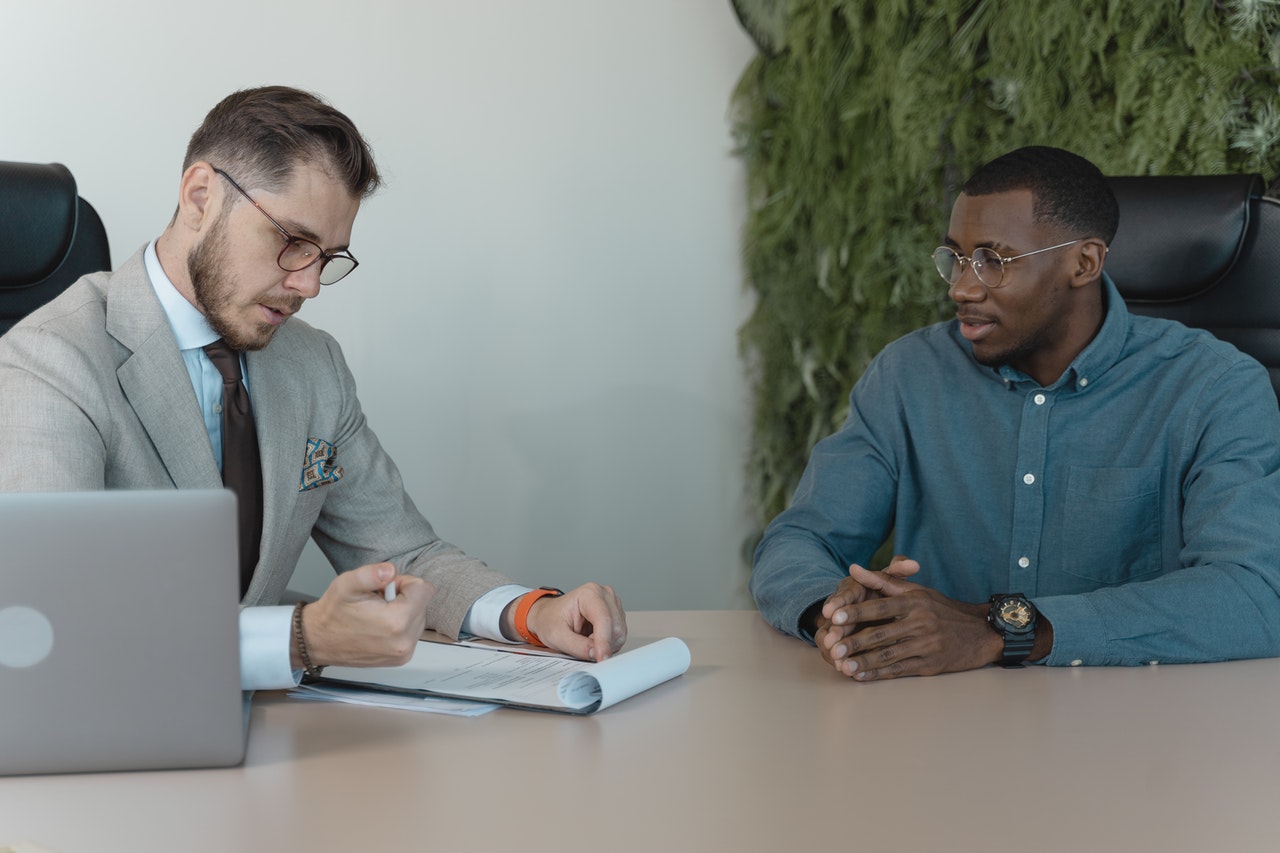 two men in a meeting