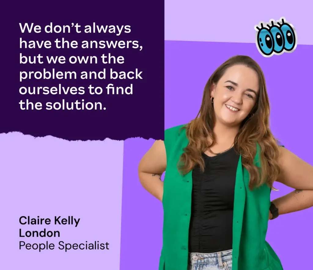 Smiling woman with long hair, wearing a green vest and black shirt against a purple background. Quote reads, "We don’t always have the answers, but we own the problem and back ourselves to find the solution."