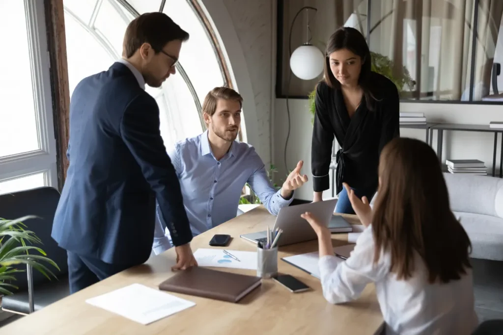 Four colleagues engaging in a discussion