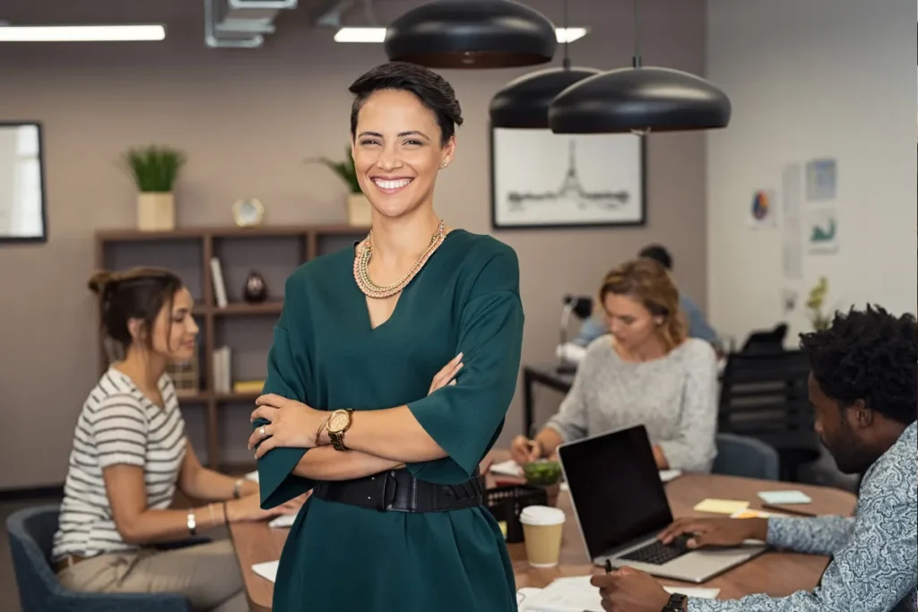 Woman smiling in front of colleagues