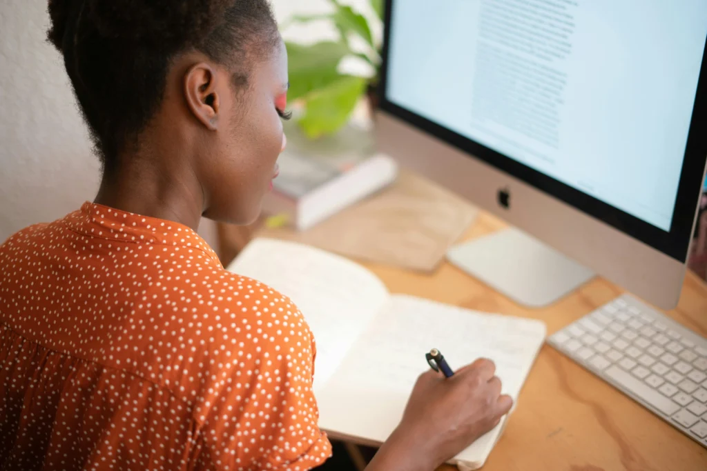Employee reviewing information on desktop computer