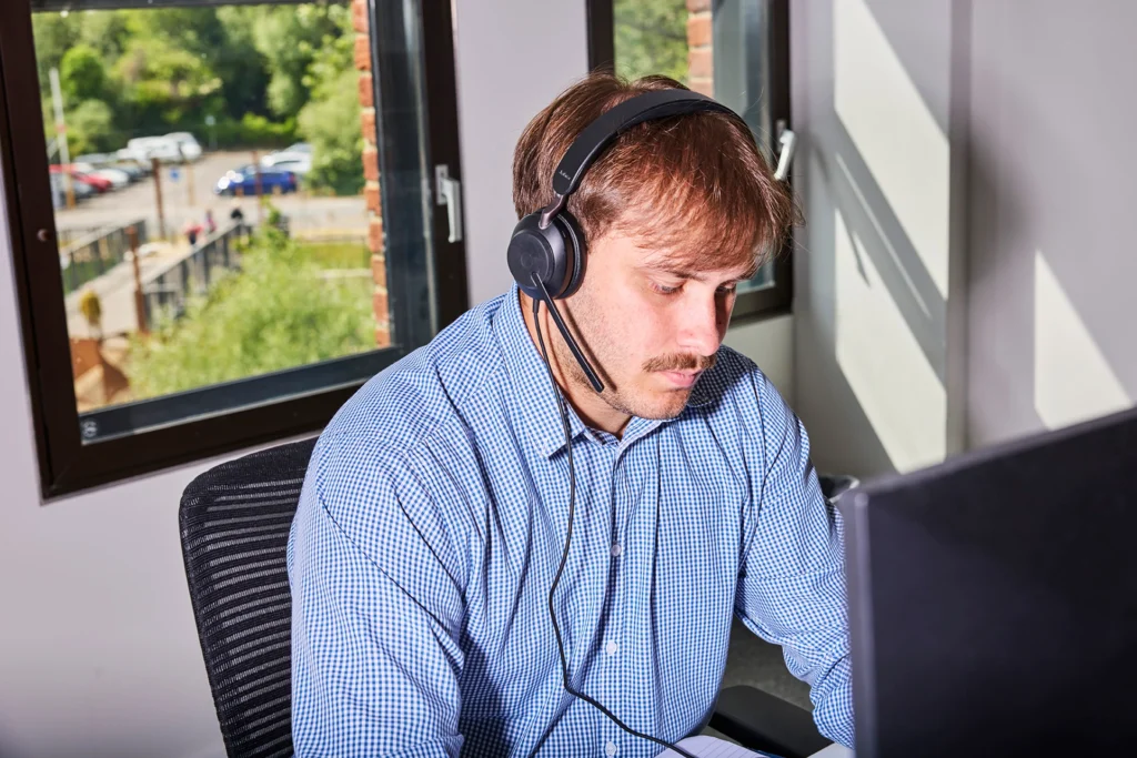 Man with a headset working