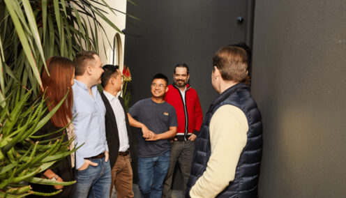 a group of colleagues laughing at a joke