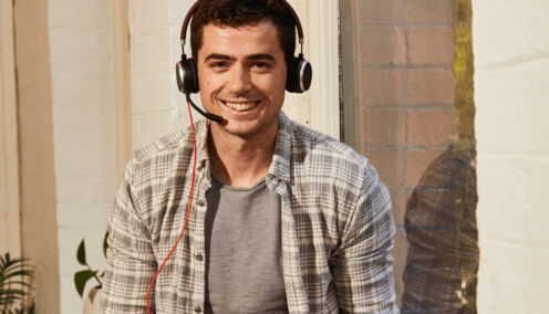 Man smiling talking on a headset